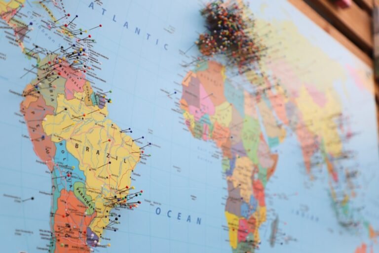 a map of the world with pins on it
