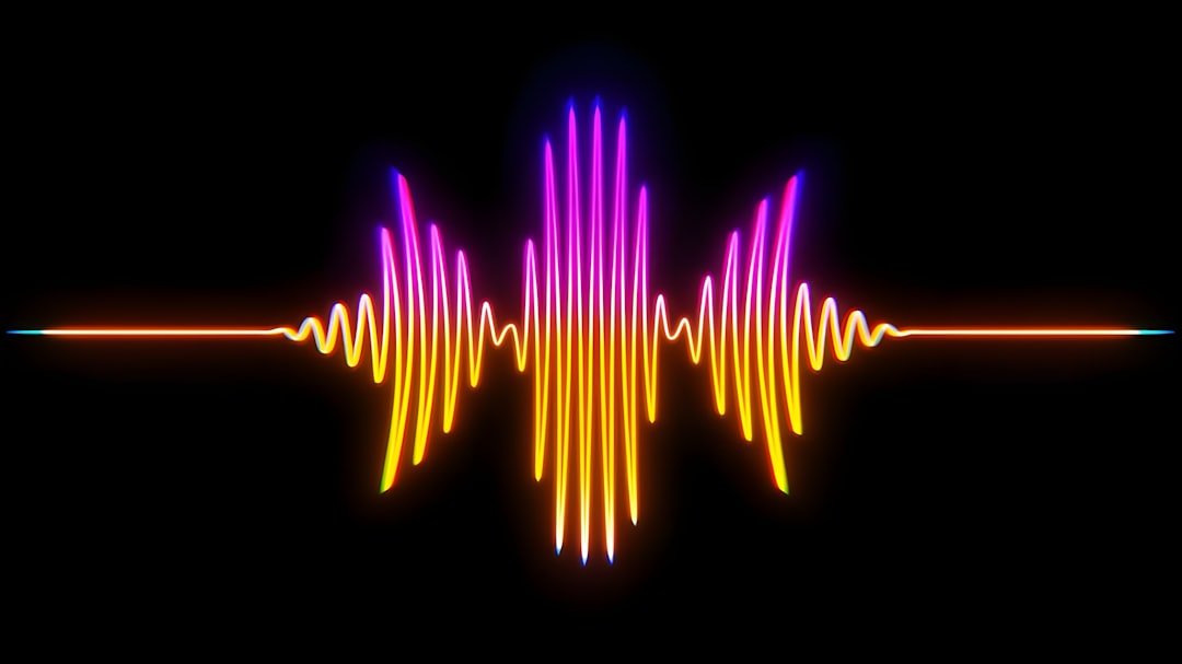 A colorful sound wave on a black background