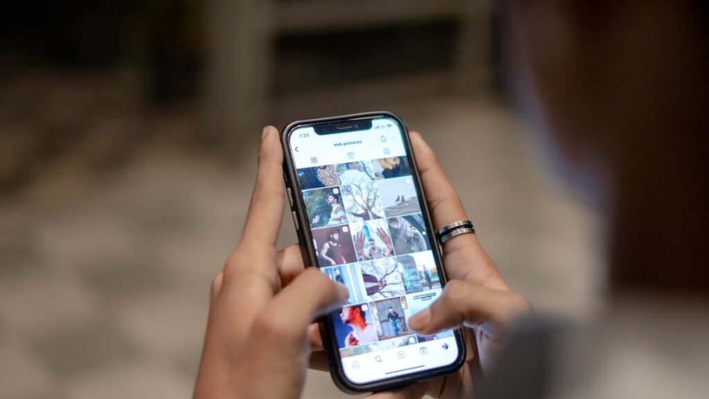 a person holding a cell phone in their hand